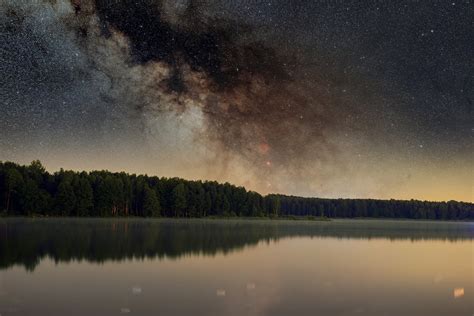 A Starry Night Sky over a Lake · Free Stock Photo