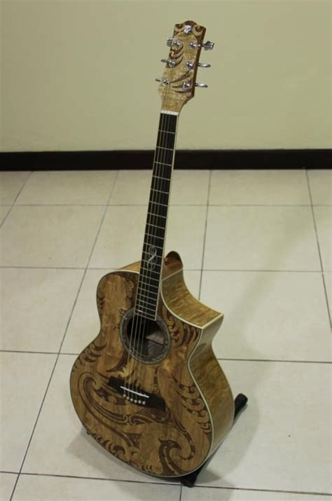 guitar with maori designs carved into it. | Acoustic guitar case, Maori designs, Guitar design