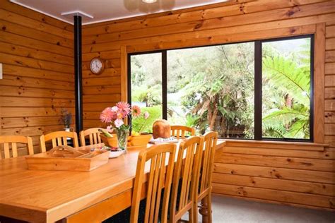 Interior of mountain wooden lodge bedroom — Stock Photo © JanMika #9001409