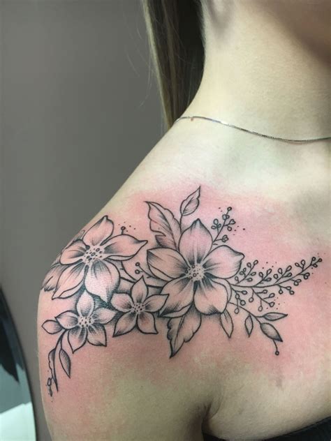 Flowers tattoo | Feminine shoulder tattoos, Flower tattoo shoulder ...