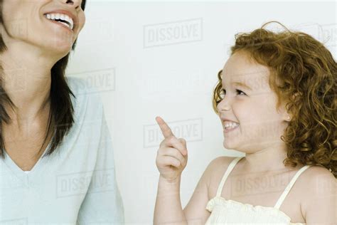 Little girl and mother, laughing - Stock Photo - Dissolve