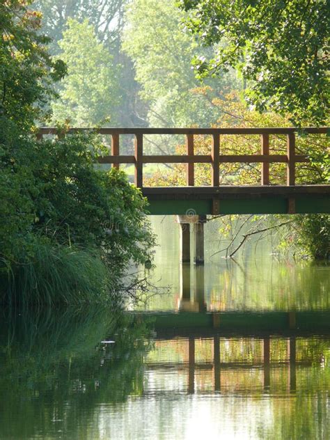 Wooden Bridge Over the Lake Stock Image - Image of bridge, rest: 227398899