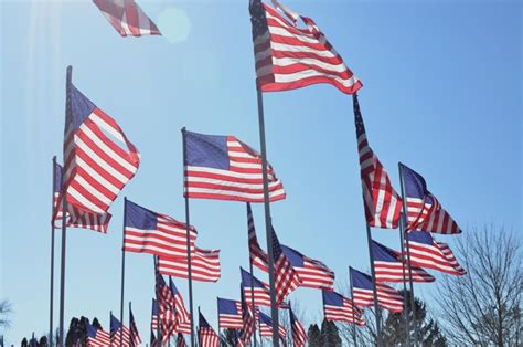 Premium Photo | American flags on flag poles