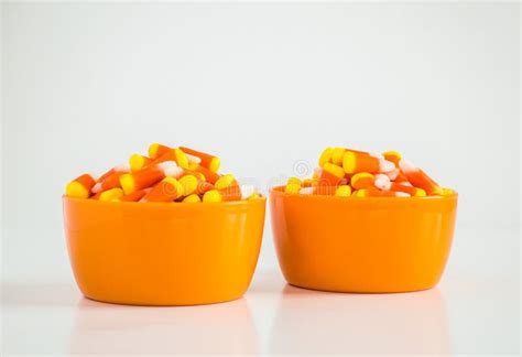 Candy Corn in Two Orange Bowls on White Stock Image - Image of haunt ...