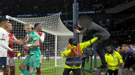 Arsenal goalkeeper Aaron Ramsdale appears to be kicked by Tottenham fan after north London derby ...