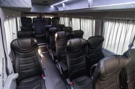 comfortable passenger bus interior with upholstered seats; individual transfer for a group of ...