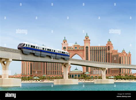 Monorail train approaching The Palm Atlantis luxury hotel on artificial Palm Jumeirah island in ...