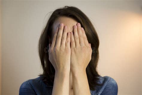 Girl Hiding Face Behind Her Hands Stock Photo - Image of covering, girls: 16673856