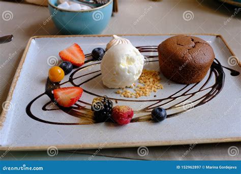 Hot Chocolate Fondant with Ice Cream. Chocolate Lava Cake on White Plate Stock Image - Image of ...