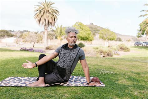 Man Sitting on Yoga Mat While Meditating · Free Stock Photo