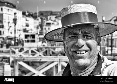 Venice Venezia Italy gondola driver with red straw hat for tourists on Grand Canal Stock Photo ...