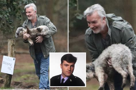 EastEnders' Nick Berry, 57, unrecognisable with a white beard as he carries his dog with wife ...