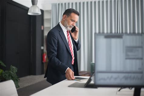 Man Wearing Black Suit in the Office · Free Stock Photo