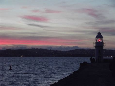 Brixham lighthouse, on the breakwater, at dusk, Brixham, South Devon, England. | South devon ...