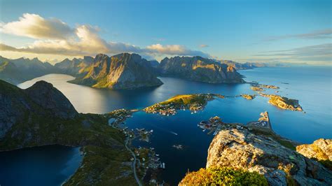 an aerial view of several islands in the ocean, with mountains and ...