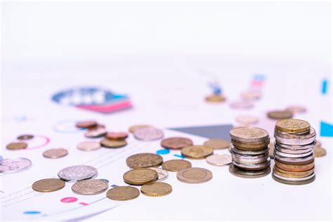 Assorted Silver-and-gold-colored Coins on Gray Surface · Free Stock Photo