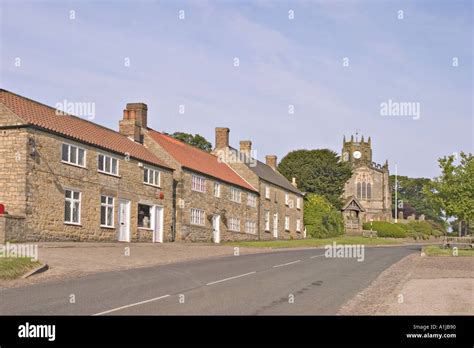 Coxwold North Yorkshire UK Cottages and church Stock Photo - Alamy