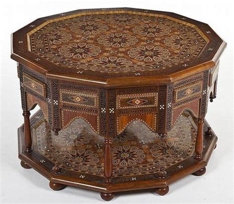 an elaborately decorated wooden table on wheels