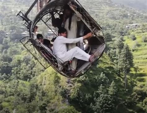 Terrifying drone video shows Pakistan cable car survivors clinging on to dear life during 15 ...