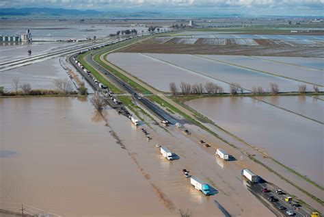 Photos: California storms cause flooding, downed trees and sinkholes