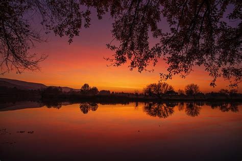 River sunset Photograph by Lynn Hopwood - Pixels