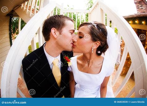 Bride and groom kiss stock photo. Image of colour, face - 36833030