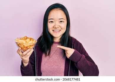 Young Chinese Girl Holding Potato Chip Stock Photo 2068177481 | Shutterstock