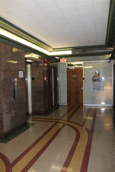 Historic elevator lobby with modern partition in background - The Georgia Trust