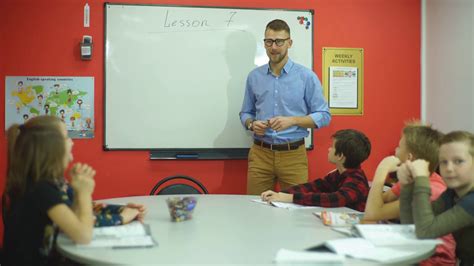 Happy Teacher Greets Students In Classroom Stock Footage SBV-311378463 ...