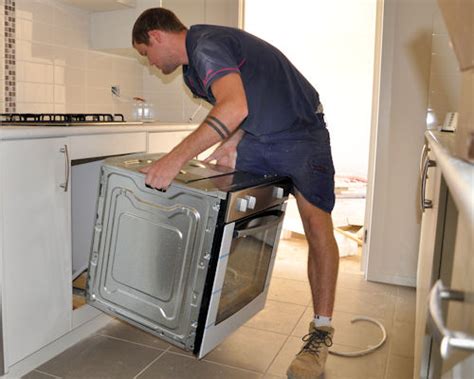 Installing cabinets on-site, Installing appliances, Ovens and stoves