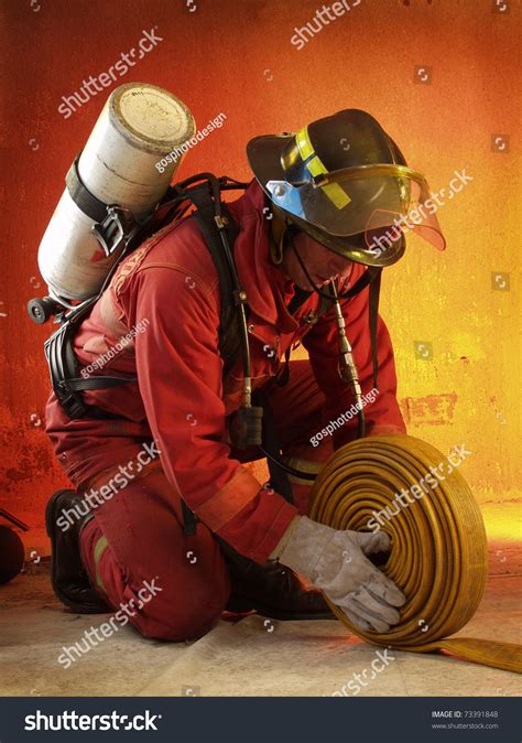 Firefighter In Action. Stock Photo 73391848 : Shutterstock