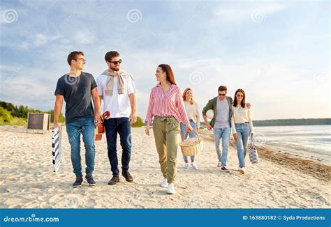 Happy Friends Walking Along Summer Beach Stock Photo - Image of friendship, person: 163880182