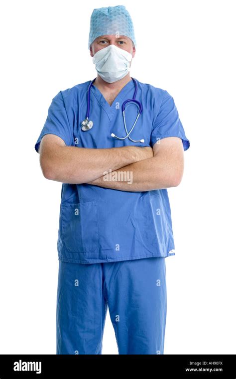 Friendly surgeon in scrubs with his arms folded Stock Photo - Alamy