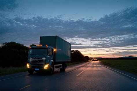 Premium AI Image | An electric truck carries cargo along the road