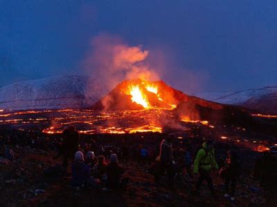 Volcano lava flows into Icelandic village, engulfing homes