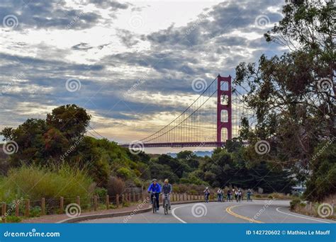 Golden Gate Bridge Sunset and Bikers on Marin County Road Editorial ...