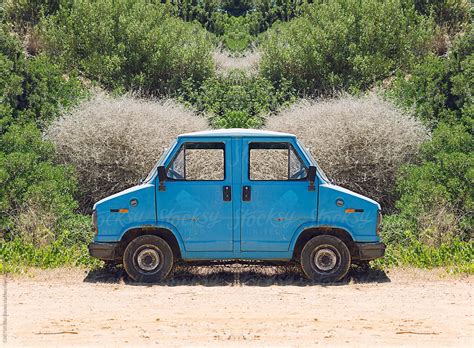 "Symmetry Image Of A Trash Car" by Stocksy Contributor "CACTUS Creative Studio" - Stocksy