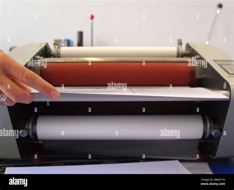 Plastic laminating machine Stock Photo - Alamy