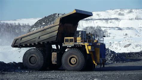 Mining Dump Trucks In The Open Pit Mine Stock Footage Video 1301332 ...