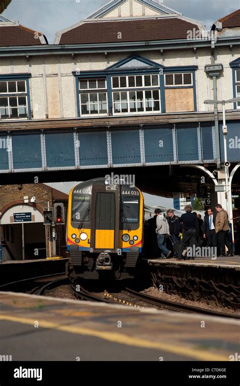 Passengers boarding a class 444 train in South West Trains livery at Clapham Junction station ...