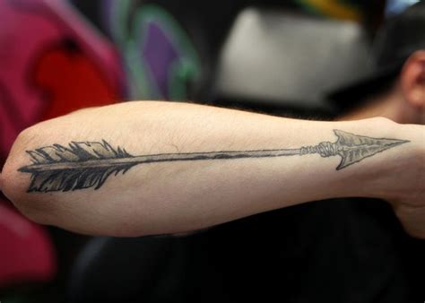 Big black arrow tattoo on arm - Tattooimages.biz