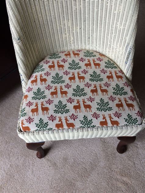 Padded seat cushion in needlepoint