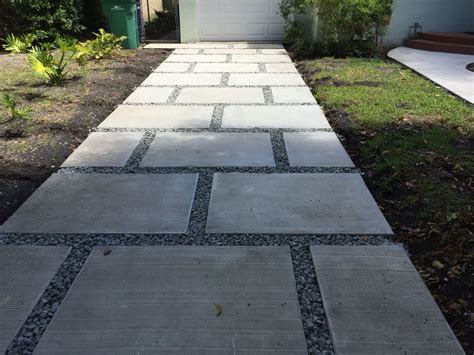 Concrete paver staggered squares design. With 1" gray granite rocks. | Concrete pavers walkway ...