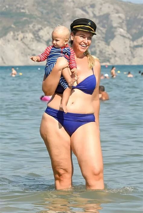 Josie Gibson flaunts results of her weight loss as she plays with baby Reggie in the sea - Irish ...