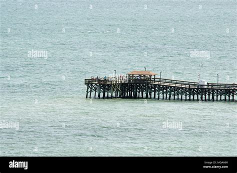 fishing pier at beach Stock Photo - Alamy