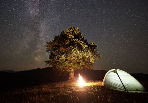 Tourist Camping at Night in the Mountains Under Starry Sky Stock Image ...