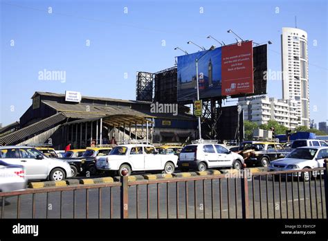 Mahalakshmi railway station & traffic on the road ; Bombay now Mumbai ...