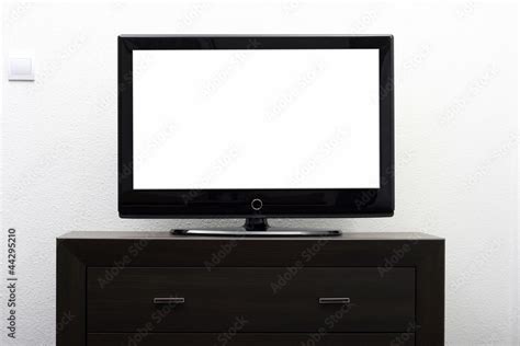 blank tv screen on brown commode against white wall Stock Photo | Adobe ...