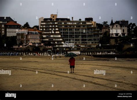 FRA - DINARD UNDER THE RAIN. Scene of life in Dinard in gray weather ...