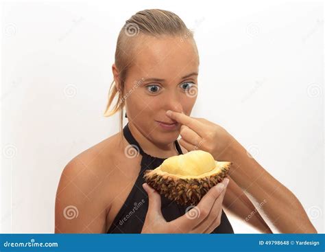 Woman smelling durian stock photo. Image of disgusting - 49798648